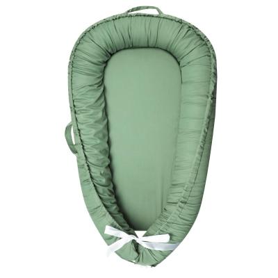 Green color infant sleeper baby nest with eco friendly padding